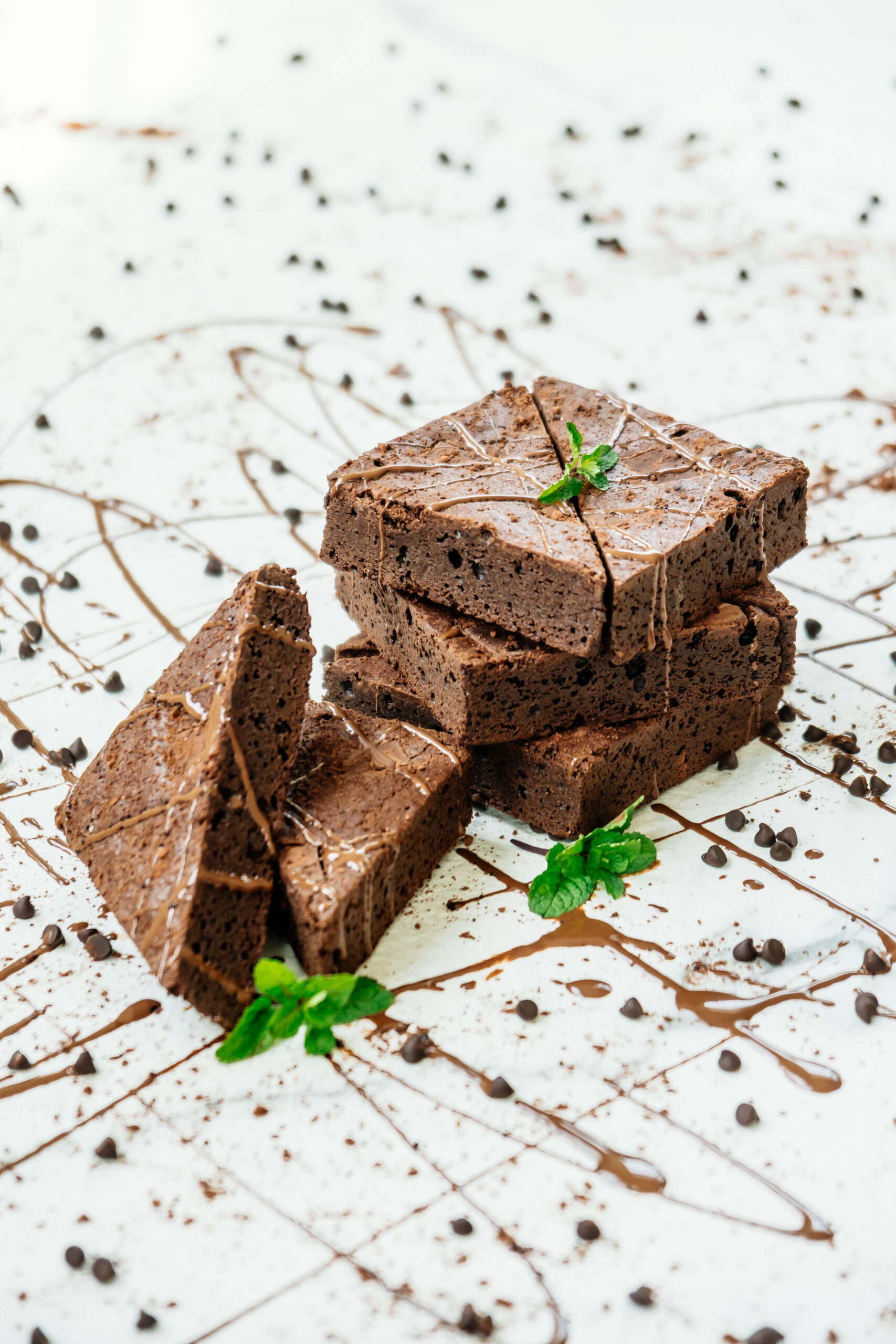 Sweet dessert with chocolate brownies on white stone background