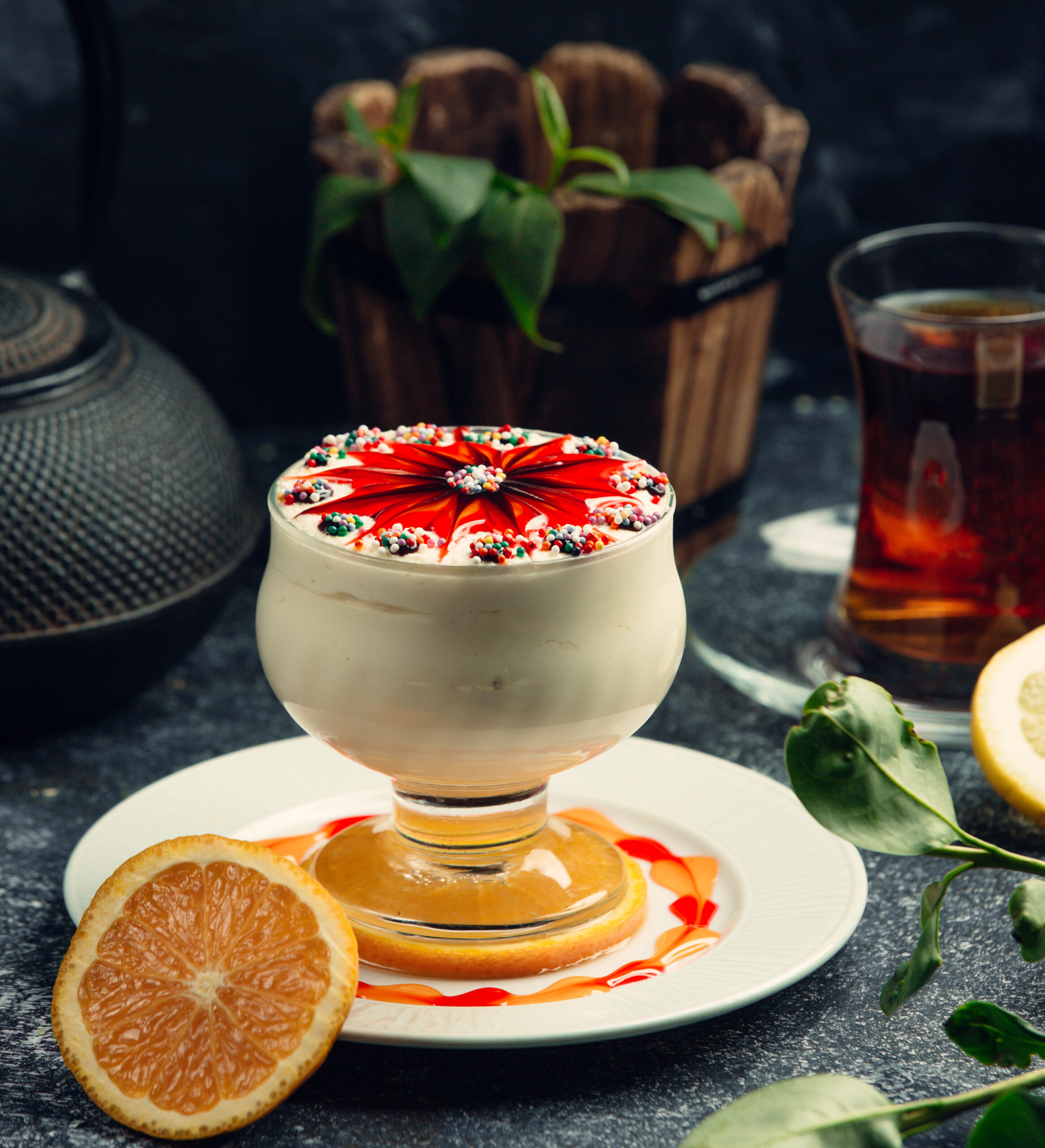 white ice cream with strawberry sirope on the table